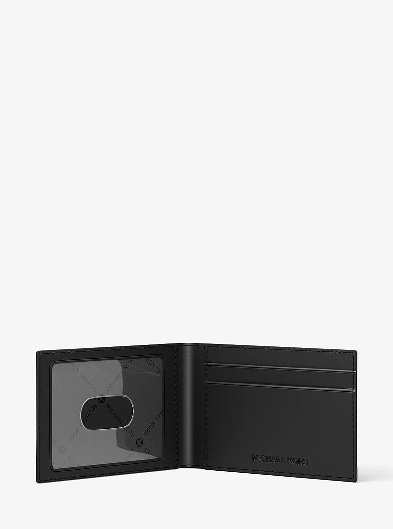 Michael Kors Cooper Logo Debossed Billfold Wallet With Passcase Black in Black – Close-up Logo Detail