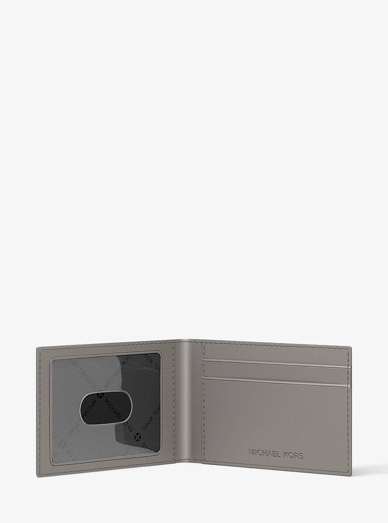 Michael Kors Cooper Logo Debossed Billfold Wallet With Passcase Pearl Grey in Pearl Grey – Close-up Logo Detail