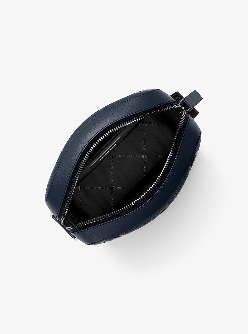 Michael Kors Cooper Logo Debossed Flight Bag Navy in Navy – Side Angle View
