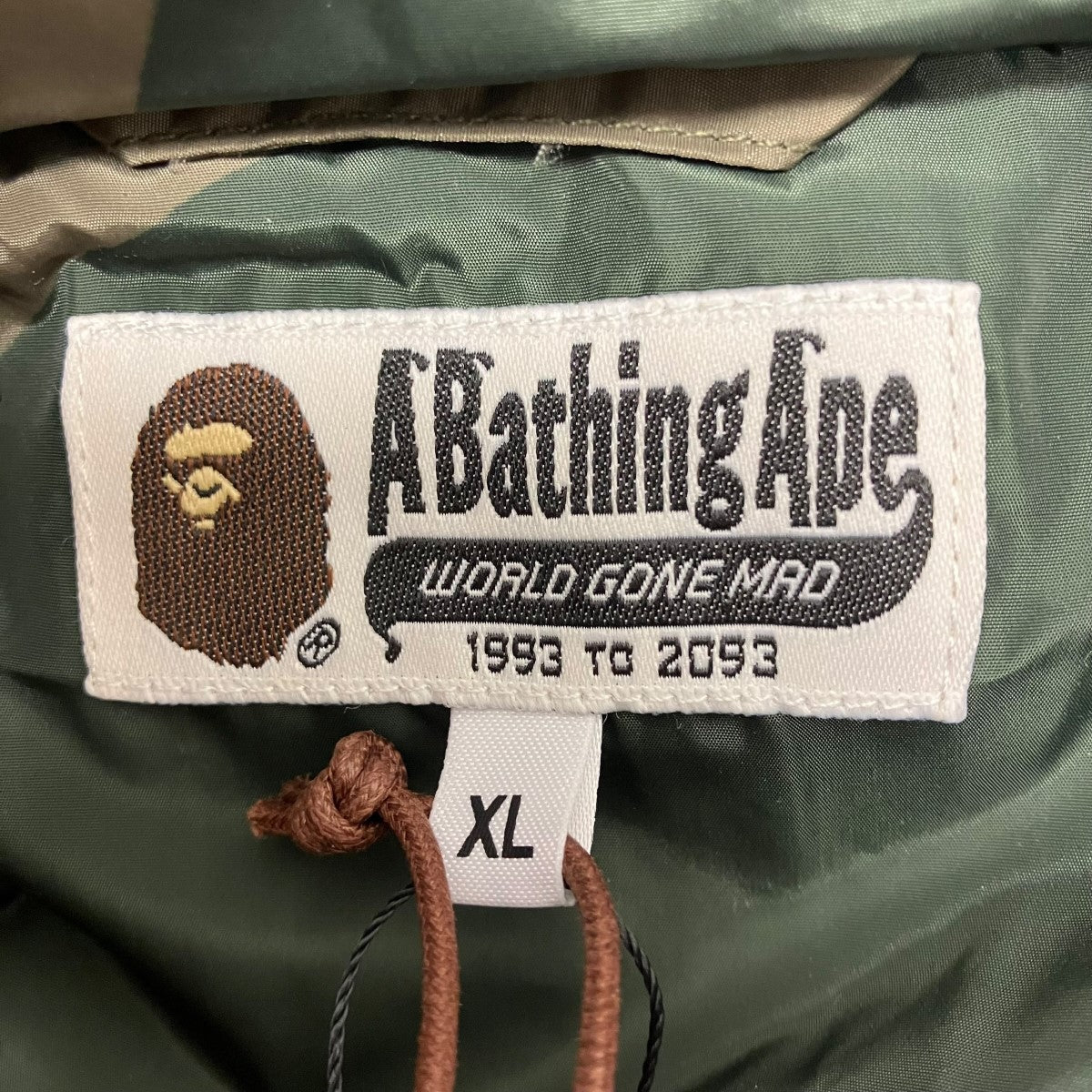 A Bathing Ape 1st Camo Nylon Down Jacket Olive (FW24) - Pre-owned