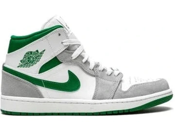 Gray and green sneaker with a prominent logo on a white background