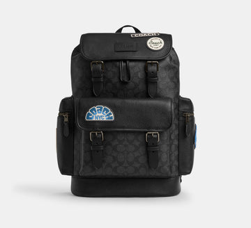 Coach Sprint Backpack In Signature Canvas With Patches Charcoal - Front View | Authentic Coach Luxury Accessories
