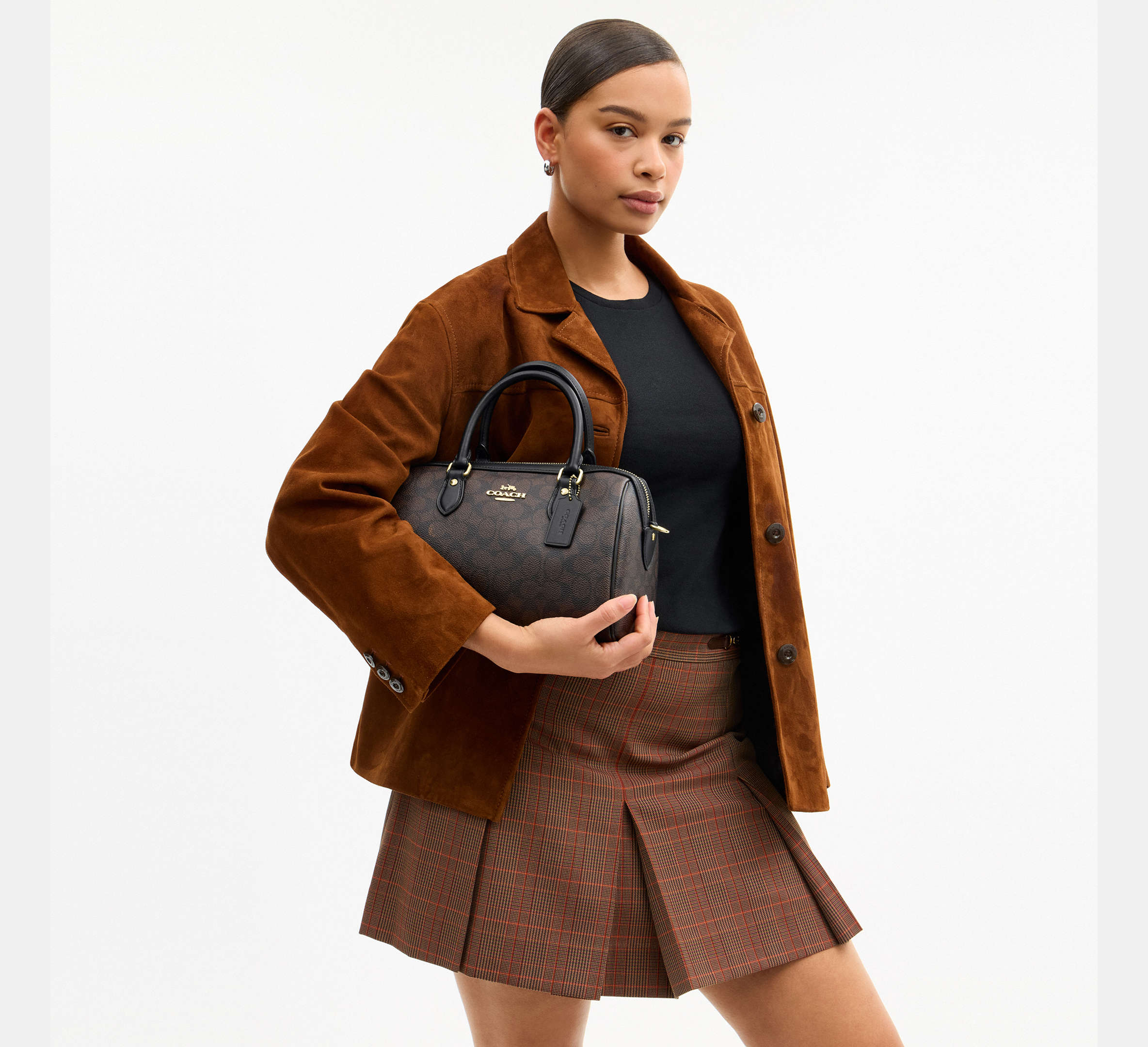 Coach Rowan Satchel Bag in Signature Canvas in Gold/Walnut/Black - On Model Side