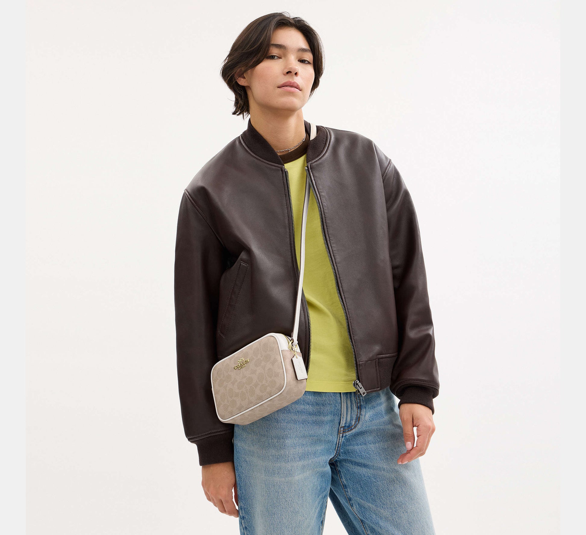 Coach Mini Jamie Camera Bag in Signature Canvas in Gold/Sand/Chalk - On Model