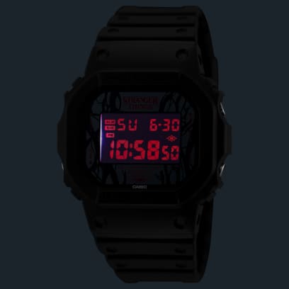 Red LED backlight glowing on the Casio G-Shock Stranger Things DW-5600STT-1 dial